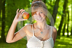 Woman holding apple as health concept