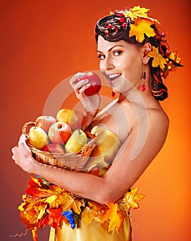 Woman holding autumn basket.