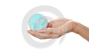 Woman holding bath bomb on white background