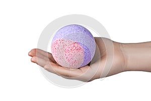 Woman holding bath bomb on white background, closeup