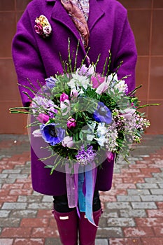 Beautiful bouquet in female hands photo