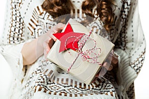 Woman holding beautifuly wrapped present, xmas concept