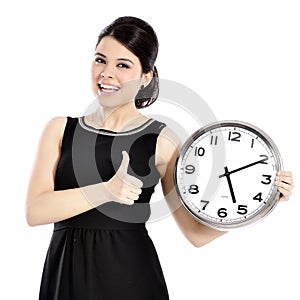 Woman holding big clock