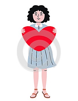 Woman holding big heart.