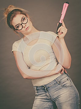 Woman holding big oversized pencil thinking about something