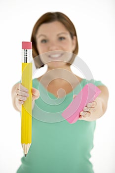 Woman Holding Big Pencil And Eraser