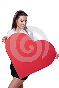 Woman holding big red heart shape banner