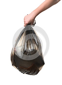 Woman holding bin bag full of garbage on white background.