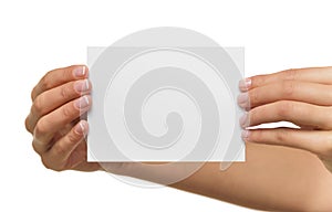 Woman holding blank business card in hand.