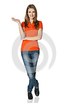 Woman holding blank copy space on her open palm standing in full length