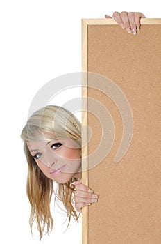 Woman holding a blank corkboard