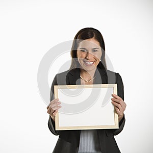 Woman holding blank sign.