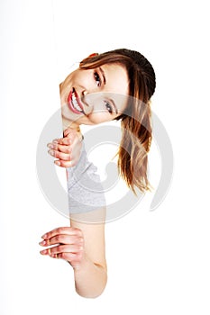 Woman is holding blank whiteboard sign