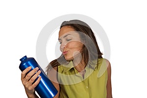 Woman holding blue bottle of water