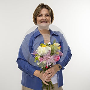 Woman holding bouquet.