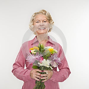 Woman holding bouquet.
