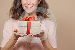 woman is holding a box with a gift for Christmas or birthday, a surprise. sale, poster for a cosmetics or jewelry store