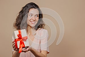 woman is holding a box with a gift for Christmas or birthday, a surprise. sale, poster for a cosmetics or jewelry store