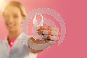 Woman holding breast cancer awareness ribbon