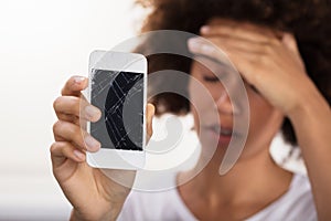 Woman Holding Broken Mobile Phone