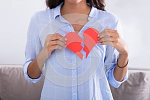 Woman Holding Broken Red Valentine Paper Heart