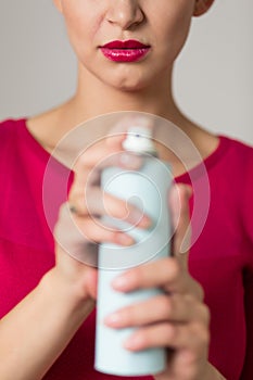 Woman holding a bug spray