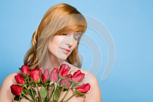 Woman holding bunch of roses