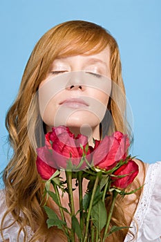 Woman holding bunch of roses