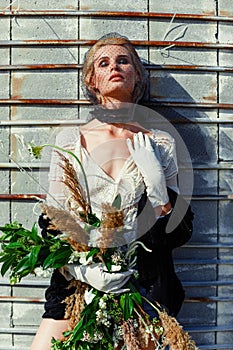 Woman holding bunch of wildflowers