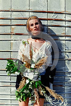 Woman holding bunch of wildflowers