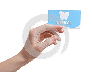 Woman holding business card on white, closeup. Dental medical service
