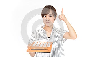 Woman holding a calculator