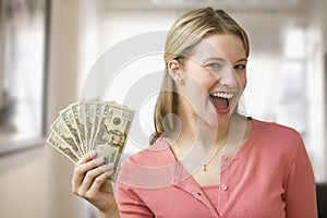 Woman Holding Cash photo