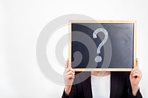 Woman holding chalkboard with question mark