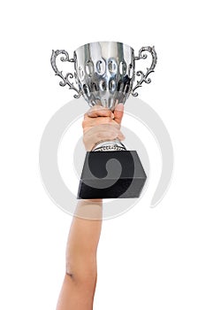 Woman holding a champion silver trophy on white background