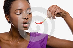 Woman holding chili pepper