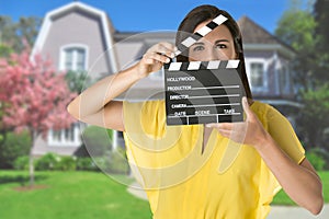 Woman Holding a Clapperboard