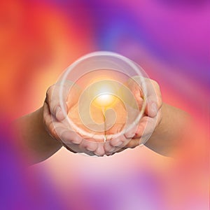 Woman holding concentrated healing energy in hands, closeup