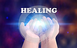 Woman holding concentrated healing energy in her hands
