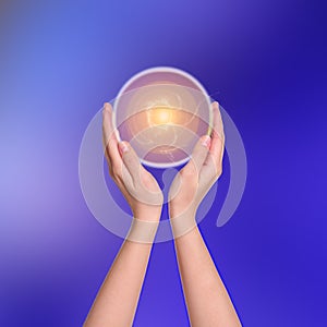 Woman holding concentrated healing energy in her hands