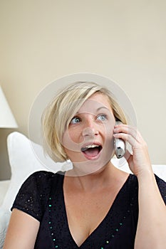 Woman holding cordless phone