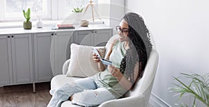 Woman holding credit card and using smartphone at home panoramic banner, businesswoman shopping online.