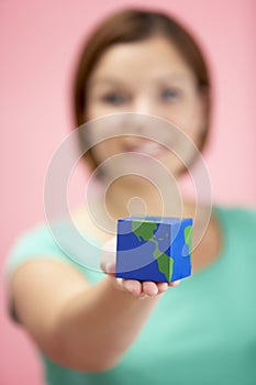 Woman Holding Cube Shaped Globe