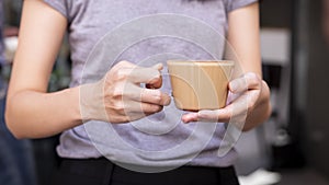 Woman holding cup of coffee