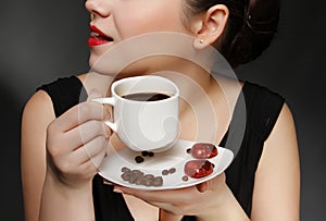 Woman holding a cup of coffee