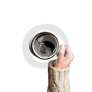 Woman holding cup of hot coffee isolated on white, closeup photo of hands in warm sweater with mug, winter morning concept, top