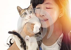 Woman holding with cute cat resting at home