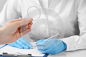 Woman holding diaphragm vaginal contraceptive ring at the doctor's appointment, closeup