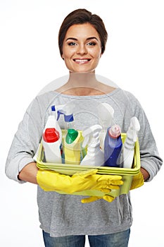 Woman holding different cleaning stuff
