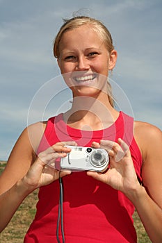 Woman holding digital camera